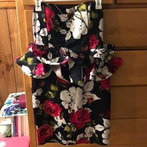 Strapless Floral peplum dress.  Fits more like a large